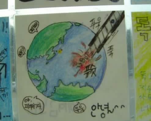 韓国の子供の絵「カッターで日本をえぐる」